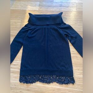 Women’s off the shoulders, black sweater with lace trim at the bottom. Size S.